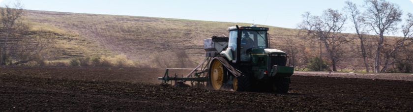 Tractor preparing a field